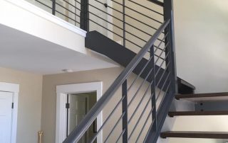 staircase with metal railing
