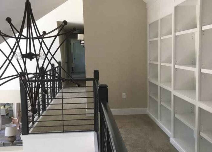 carpeted floor with white walls and ceiling